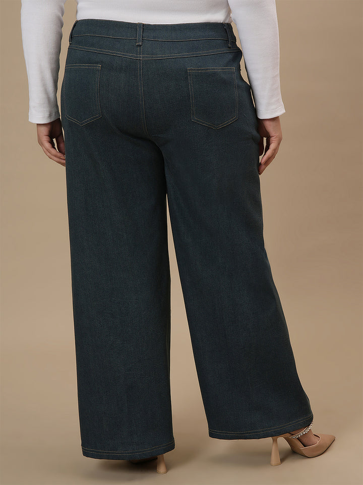 Plus-size woman in back side view wearing Green Plus Size Wide Leg Jeans with relaxed fit and clean finish