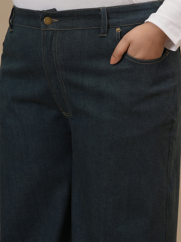 Close-up view of Green Plus Size Wide Leg Jeans showing waistband and structured denim fabric