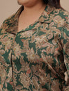 Close-up view of Green Satin Plus Size Co-Ord Set showing front button detail and glossy satin fabric
