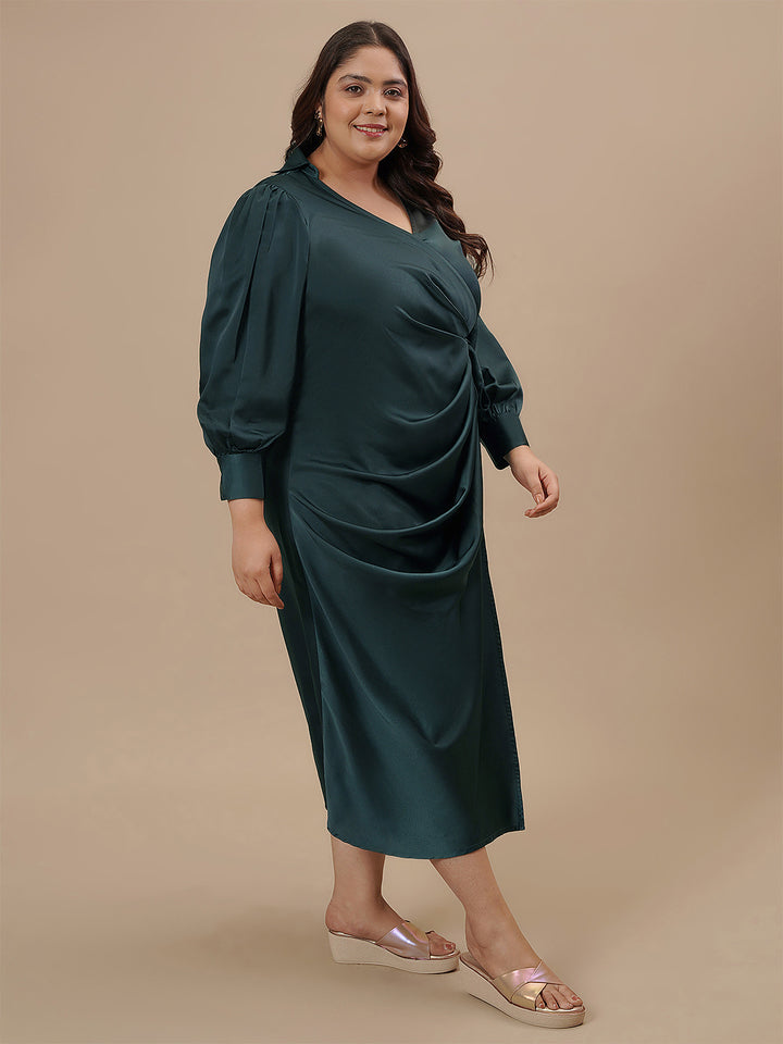 Plus-size woman in front right angle view wearing Green Satin Plus Size Wrap Dress with satin sheen and wrap fit