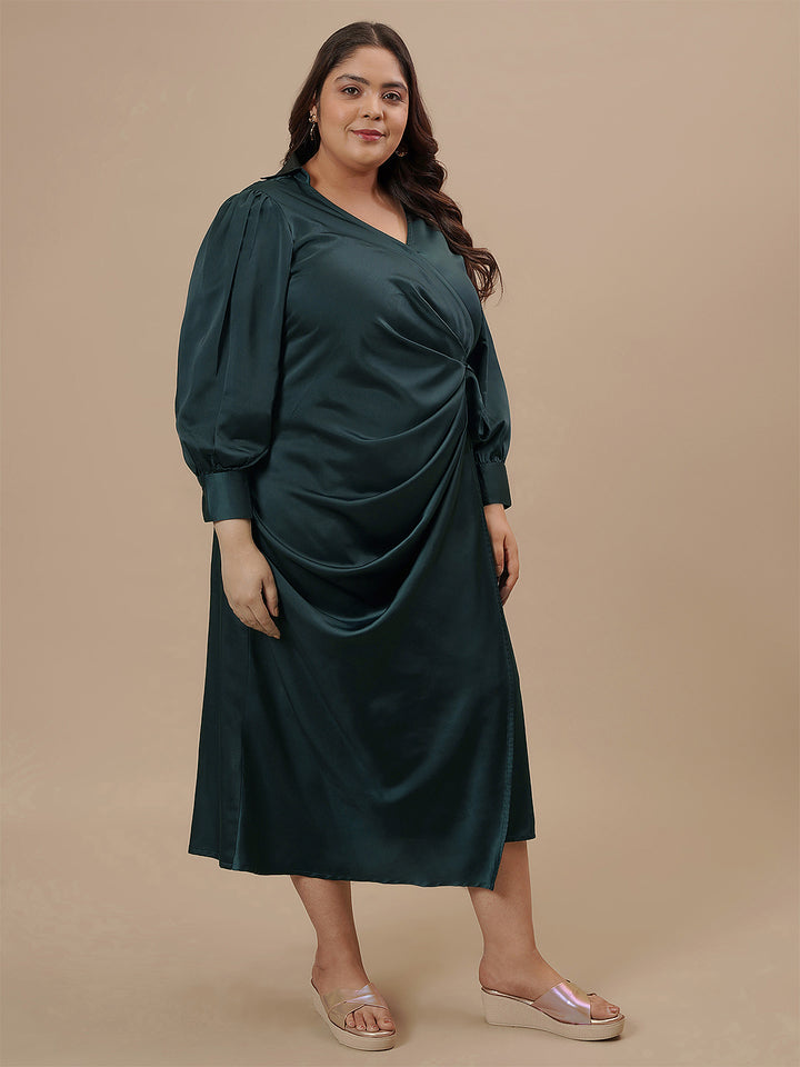 Plus-size woman in side view wearing Green Satin Plus Size Wrap Dress with waist tie and flowy silhouette