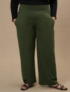 Plus-size woman in front view wearing Green Wide Leg Plus Size Pants featuring relaxed fit and full-length silhouette