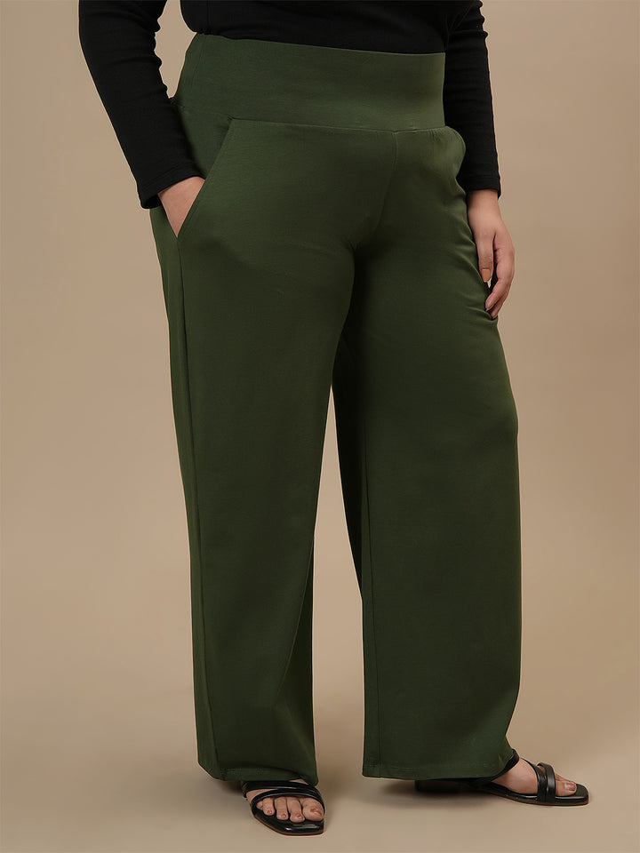 Plus-size woman in right side view wearing Green Wide Leg Plus Size Pants with high waist and flowy wide-leg cut