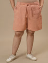 Plus-size woman in front view wearing High-Waisted Plus Size Cotton Shorts with relaxed fit and elastic waistband