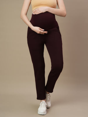Front view of Wobbly Walk Wine Berry Maternity Fleece Pants featuring an over-belly, elastic-free waistband