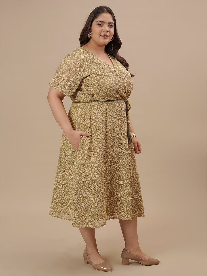 Plus-size woman in right side view wearing Olive Green Plus Size Lace Dress with scalloped hem and lace design