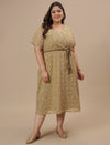 Plus-size woman in side front view wearing Olive Green Plus Size Lace Dress with V-neck and lace sleeves