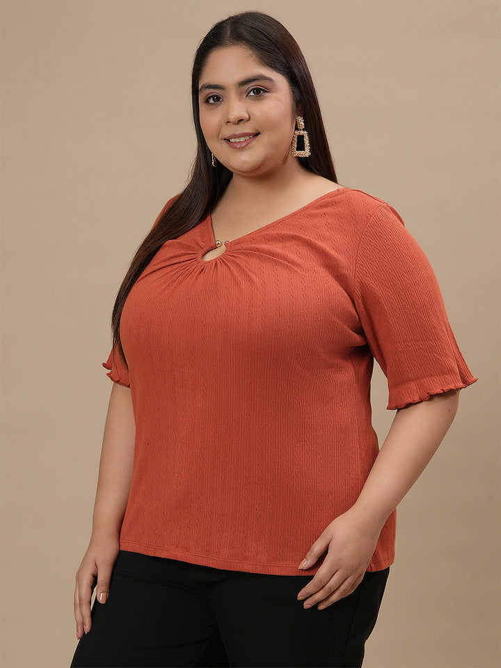 Plus-size woman in front left angle view wearing Orange Plus Size V Neck Top with soft fabric and casual cut