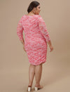 Plus-size woman in back side view wearing Pink Plus Size Bodycon Dress with clean back and maxi length