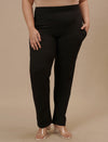 Plus-size woman in casual pose wearing Plus Size Black Casual Pants with elastic waist and easy fit