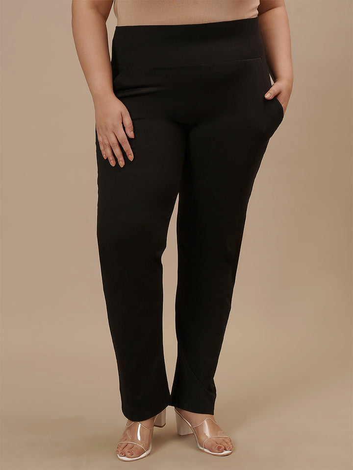 Plus-size woman in casual pose wearing Plus Size Black Casual Pants with elastic waist and easy fit