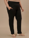 Plus-size woman in right side view wearing Plus Size Black Casual Pants with relaxed fit and straight leg