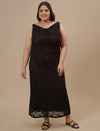 Plus-size woman in front pose wearing Plus Size Black Party Dress featuring sleeveless design and elegant shape