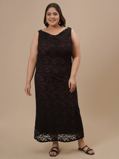 Plus-size woman in front pose wearing Plus Size Black Party Dress featuring sleeveless design and elegant shape