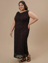 Plus-size woman in side view wearing Plus Size Black Party Dress with sleeveless cut and flattering fit