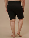 Plus-size woman in back view wearing Plus Size Cycling Shorts in Black with smooth back and secure waistband
