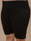 Close-up view of Plus Size Cycling Shorts in Black showing high-rise waistband and stretch fabric