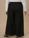 Plus-size woman in back side view wearing Black Plus Size Linen Palazzo Pants with relaxed back and wide leg