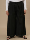 Plus-size woman in front view wearing Black Plus Size Linen Palazzo Pants with wide-leg fit and high-rise waist