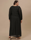 Plus-size woman in back view wearing Plus Size Long Black Dress with fitted waist and flowing skirt