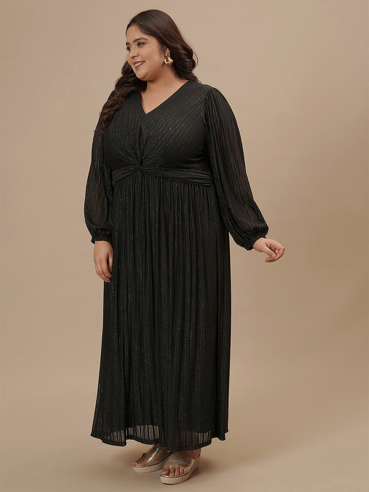 Plus-size woman in side view wearing Plus Size Long Black Dress featuring long sleeves and relaxed fit