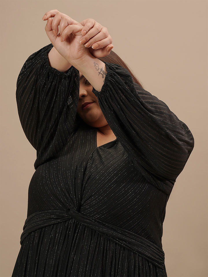 Close-up of Plus Size Long Black Dress showing sheer long sleeve with delicate pleating and soft fabric