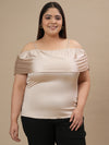 Plus-size woman in front view smiling while wearing Plus Size Off Shoulder Top with elastic neckline and flowy sleeves
