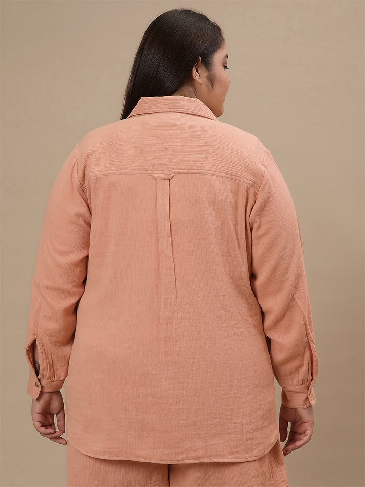 Plus-size woman in back view wearing Plus Size Orange Cotton Top with short sleeves and soft cotton fabric