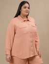 Plus-size woman in front right angle view wearing Plus Size Orange Cotton Top featuring short sleeves and relaxed silhouette