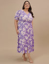 Plus-size woman smiling in front angled view wearing Plus Size Puff Sleeve Dress with gathered detail and puff sleeves