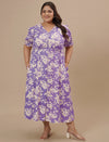 Plus-size woman with hands in pockets wearing Plus Size Puff Sleeve Dress with relaxed fit and flared hem