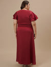 Plus-size woman in back view wearing Plus Size Red Satin Gown with flowing hem and elegant back design