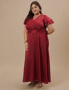 Plus-size woman in side view wearing Plus Size Red Satin Gown with soft satin drape and flattering silhouette