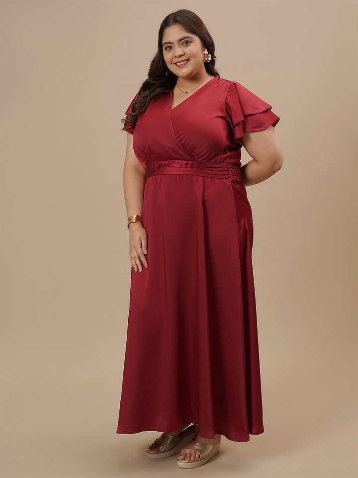Plus-size woman in side view wearing Plus Size Red Satin Gown with soft satin drape and flattering silhouette