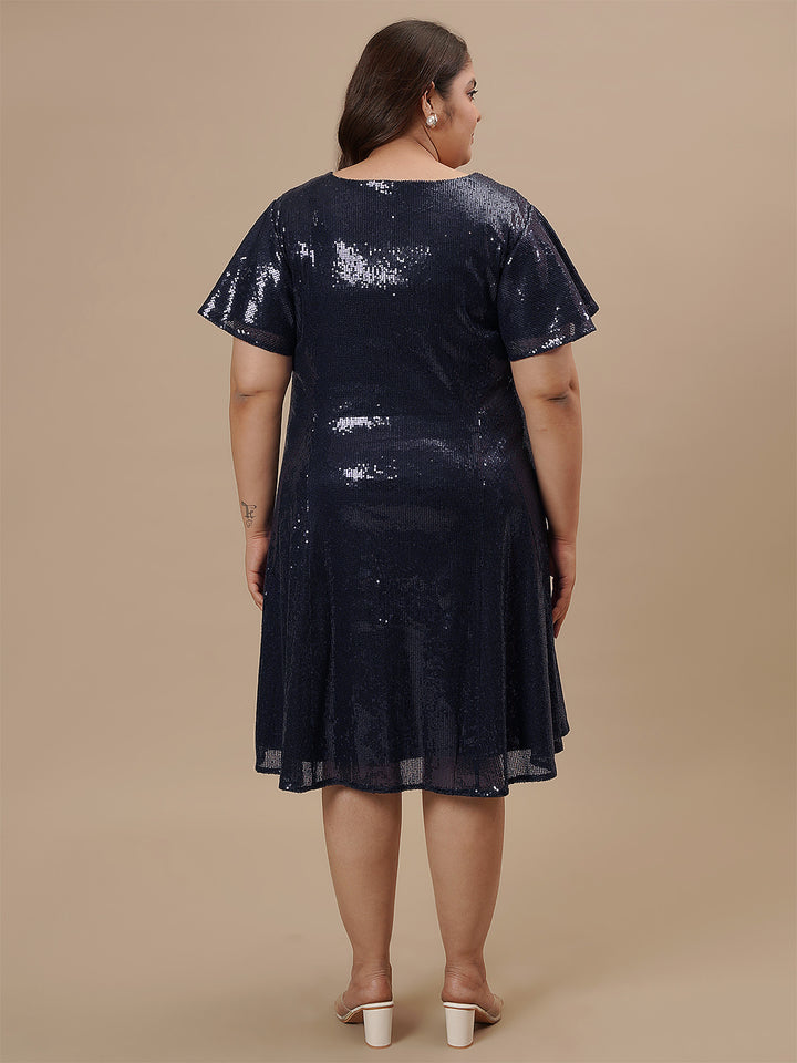Plus-size woman in back view wearing Plus Size Sequin Blue Dress with zip closure and sequin detail