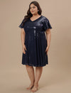 Plus-size woman in side angle wearing Plus Size Sequin Blue Dress featuring sequin texture and fitted shape
