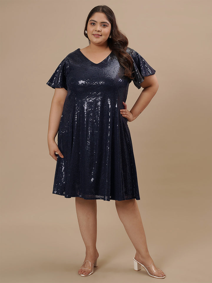 Plus-size woman standing straight in Plus Size Sequin Blue Dress featuring sleek fit and shimmering sequins