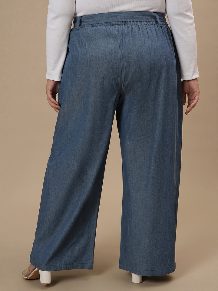 Plus-size woman in back view wearing Plus Size Wide Leg Jeans in blue with clean back and wide-leg silhouette