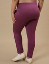 Plus-size woman in back side view wearing Purple Plus Size Leggings With Pockets with fitted shape and smooth back
