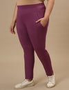 Plus-size woman in front left angle view wearing Purple Plus Size Leggings With Pockets with contour fit and high-rise waist