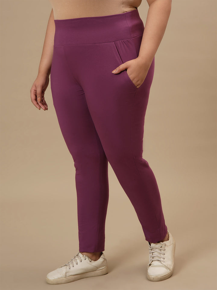 Plus-size woman in front left angle view wearing Purple Plus Size Leggings With Pockets with contour fit and high-rise waist