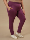 Plus-size woman in front right angle view wearing Purple Plus Size Leggings With Pockets with high waist and stretch fit