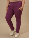 Plus-size woman in left side view wearing Purple Plus Size Leggings With Pockets featuring snug fit and side pocket