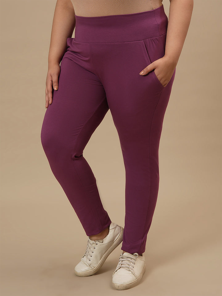 Plus-size woman in left side view wearing Purple Plus Size Leggings With Pockets featuring snug fit and side pocket