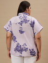 Plus-size woman in back view wearing Purple Plus Size Linen Shirt featuring long sleeves and curved hem