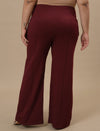 Plus-size woman in back view wearing Red Plus Size Flare Pants with tailored back and relaxed fit