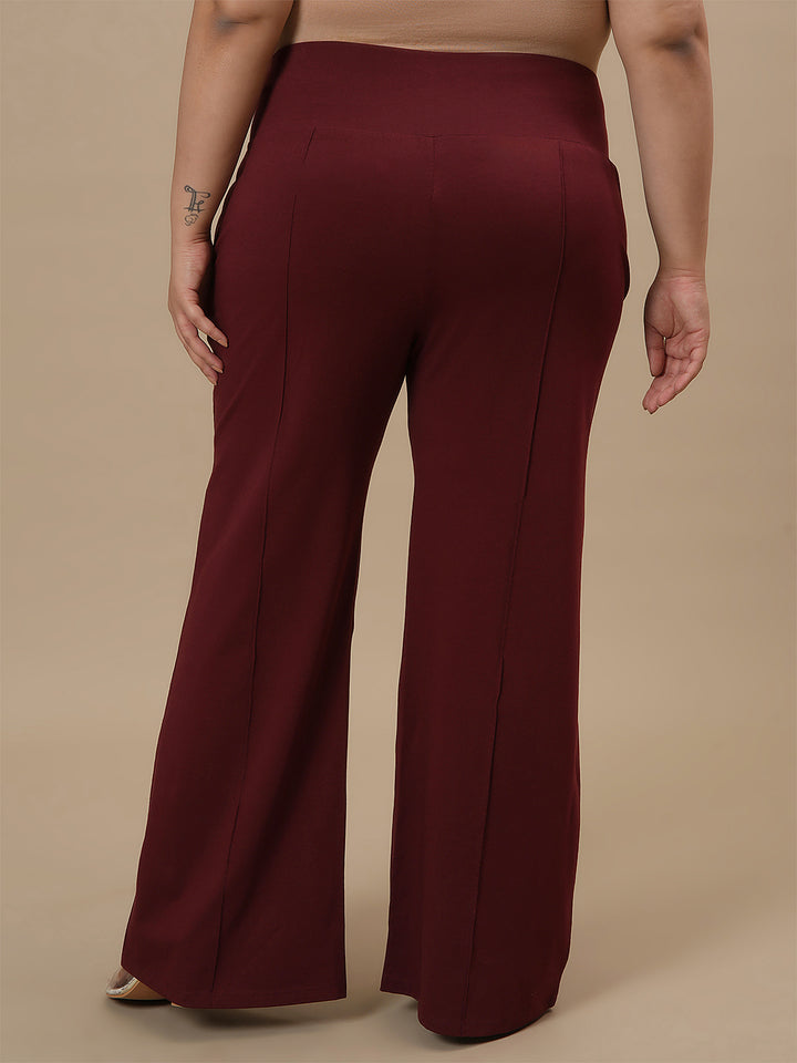 Plus-size woman in back view wearing Red Plus Size Flare Pants with tailored back and relaxed fit