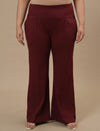 Plus-size woman in front view wearing Red Plus Size Flare Pants featuring wide leg and clean finish