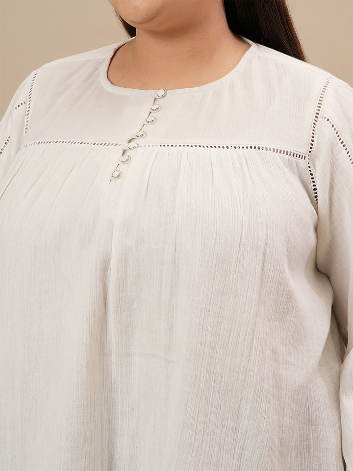 Close-up view of White Cotton Plus Size Top showing full sleeves and soft, breathable cotton fabric