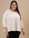 Plus-size woman in front view wearing White Cotton Plus Size Top with full sleeves and soft cotton texture